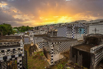 Famous cemetery, many mausoleums or large crypts decorated with tiles, often in black and white....