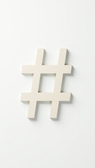 Obraz premium simple beige hashtag symbol on a white background