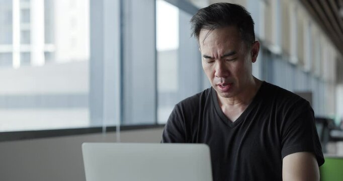 Asian businessman burn out on failed job in office. Elderly office worker expresses emotions Failed to work No success. Financial Communication Business problem. Working too hard overtime
