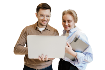 Colleagues collaborating on a laptop while discussing ideas in a bright, modern office environment