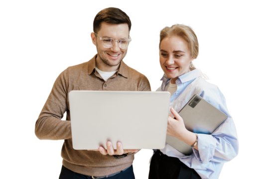 Colleagues collaborating on a laptop while discussing ideas in a bright, modern office environment
