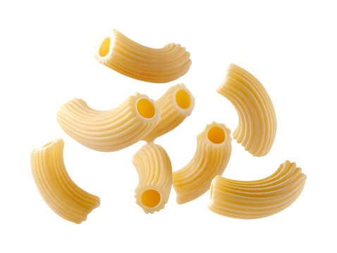 Floating Uncooked cavatappi pasta pieces highlighting their spiral ridges on transparent background