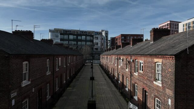 A video of Anita Street (Formerly Sanitary Street). A Victorian Street from the Industrial Revolution era. The video cranes upwards to reveal Manchester's City Skyline