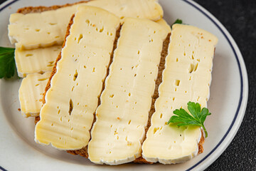Sandwich soft cheese Camembert or Brie fresh delicious gourmet food background on the table rustic food top view copy space