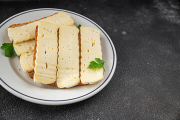 Sandwich soft cheese Camembert or Brie fresh delicious gourmet food background on the table rustic food top view copy space