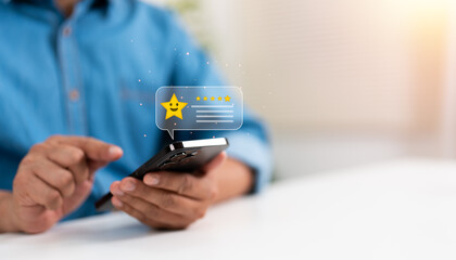 A man give rating on Mobile phone to service experience on online application, Evaluate quality of service to reputation ranking of business. Customer review satisfaction feedback survey concepts.