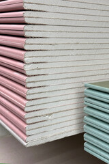 stack of drywall construction sheets	