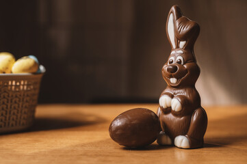 Chocolate Easter bunny and Easter eggs still life close-up copyspace