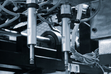 PVC plastic bottle production machine by extrusion and hot blowing technology industrial concept background