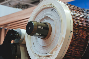 Fragment of the conveyor of sticking labeling machine for packaging food products or...