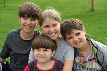 children sitting on the grass