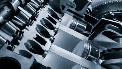 A close up of a car engine with the pistons and cylinders visible. Concept of complexity and...
