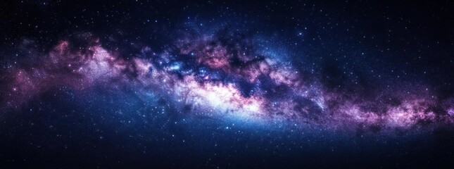 Naklejka premium Celestial Symphony: The Milky Way Galaxy unfurls in a mesmerizing panorama, a ribbon of cosmic dust and incandescent stars painted across the deep, infinite canvas of space.