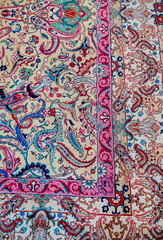 Fototapeta premium Persian Carpet texture with pink and blue ornaments