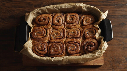 Twelve cinnamon rolls just out of the oven.