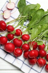 Many fresh radishes on white wooden table, top view