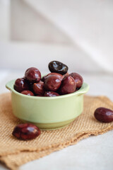 Olives kalamata on shadows background