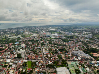 Drone view of Iloilo City with houses and colonial churches. Panay Island. Philippines.