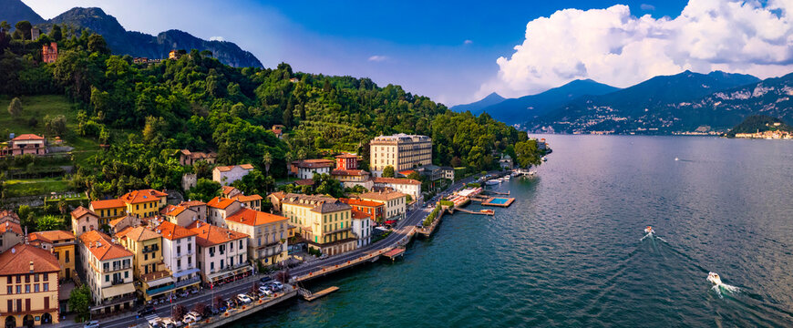Lago di Como - beautiful famous lake in northen Italy, Lombardy region. Panoramic drone high angle view of scenic Tremezzina village . Italian romantic travel destinations