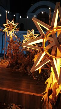 Close-up of a Christmas star ornament glowing warmly, perfect for holiday themes.