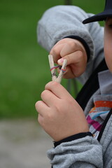 boy with a slingshot in the park,