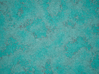 Detailed surface of cement with a mix of light turquoise and grey, showing a rough texture.