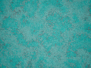 Surface texture of turquoise cement with irregular grey marks throughout.
