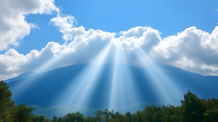 Sunbeams pierce clouds over mountains