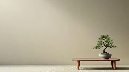 Minimalist interior with a bonsai tree on a wooden table against a soft, neutral background