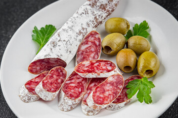 Fuet sausage Spanish meat delicacy fresh delicious gourmet food background on the table rustic food...