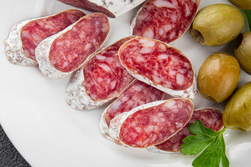 Fuet sausage Spanish meat delicacy fresh delicious gourmet food background on the table rustic food top view copy space