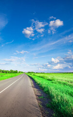 Long road with a clear blue sky above it