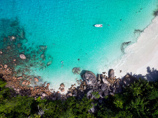Anse Cocs beach, La Digue Seychelles, tropical beach during a luxury vacation in Seychelles. Tropical beach Anse Cocs beach, La Digue, Praslin, Mahe Seychelles with turqouse colored ocean