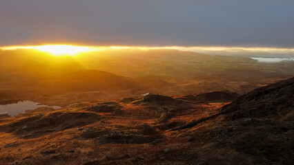 Spectacular sunrise over mountains and landscape