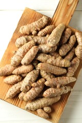 Tumeric rhizomes on white table, top view