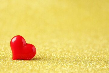 Fototapeta premium Red decorative heart on shiny golden background, space for text. Happy Valentine's day