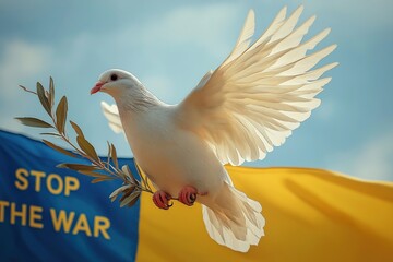 Obraz premium White dove soaring with olive branch on ukrainian flag and sky background with message stop war