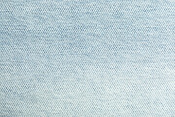 Texture of light blue jeans as background, closeup