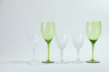 Many empty clean glasses on light background