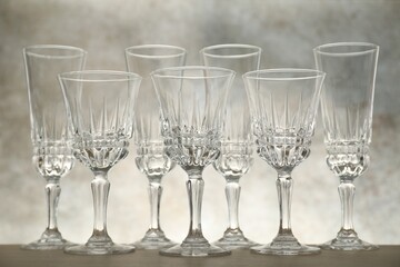 Many empty clean glasses on wooden table