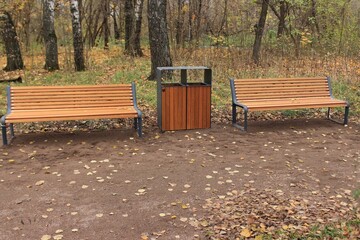 New benches for relaxing in the city park. Moscow. Russia.