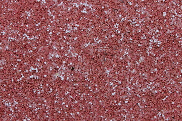 White snowflakes on a red surface. Macro. Russia.