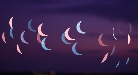 Abstract pink and blue crescent moon bokeh lights night sky background on transparent background art
