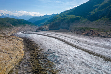 Aerial drone view of Great Aletsch Glacier Alps Switzerland in sunny summer day. Popular tourist destination