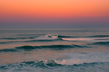 Most Beautiful Sunrise on the Ocean. Golden Hour on the Beach. The Sky in bright pink and blue...