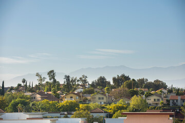 Afternoon light shines on houses in Chino Hills, California, USA.