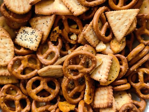 Crackers and Pretzels. Mixed salty snack for party. Appetizer salted biscuit