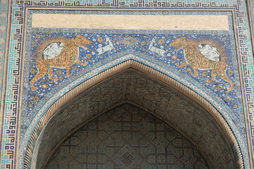 bright mosaic of ceramic tiles above the entrance arch of the madrasah, Samarkand