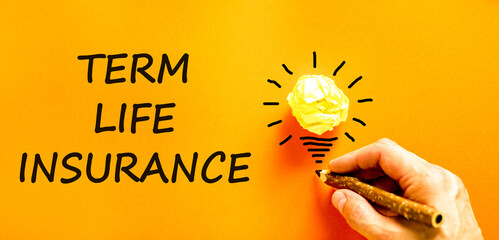Term life insurance symbol. Concept words Term life insurance on beautiful orange paper. Beautiful...