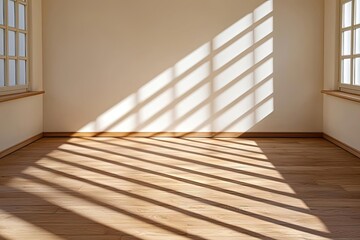 Minimalist interior of a room with soft natural light casting diagonal shadows on the wooden floor, creating a serene and peaceful atmosphere.